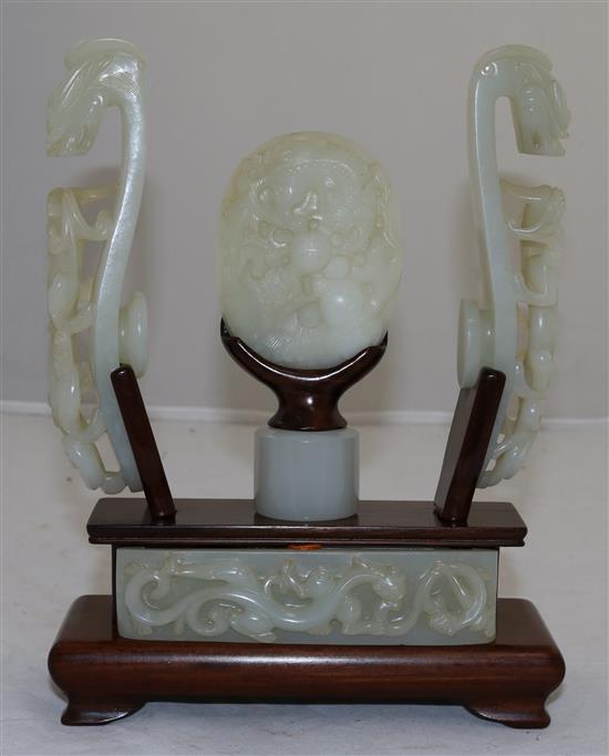 A collection of Chinese archaistic pale celadon jade belt fittings and a white jade archers ring, 17th-19th century,